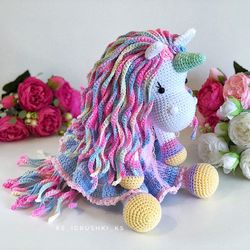 crochet animal. unicorn toy blue, pink, purple, yellow