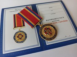 ukrainian award medal "defender of ukraine. will, honor, courage" with diploma. glory to ukraine