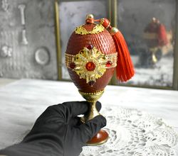 red figurine-egg on a curly stand collectible statuette egg