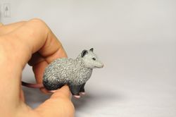 tiny gray opossum figure