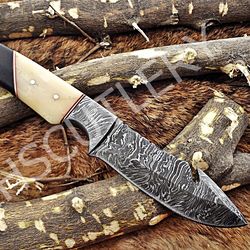 custom handmade damascus steel hunting skinner guthook knife with horn handle and leather sheath.