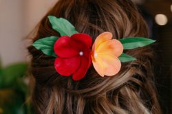 orange red plumeria flower hair comb, tropical headpiece, hawaiian hair clip, tiki hair flower realistic.