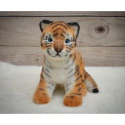 stuffed toy tiger. realistic toy tiger.