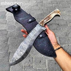 custom handmade damascus steel bushcraft hunting knife with antler handle and leather sheath.