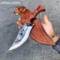 custom handmade carbon steel bushcraft hunting knife with wood handle and leather sheath.