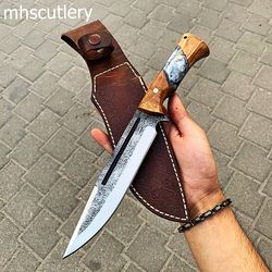 custom handmade carbon steel bushcraft hunting knife with wood handle and leather sheath.