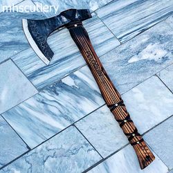 custom handmade carbon steel bushcraft viking axe with wood handle and leather sheath.