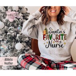 santa's favorite nurse sweatshirt gift for christmas, leopard nurse sweatshirt, plaid er nurse gift, christmas tree swea