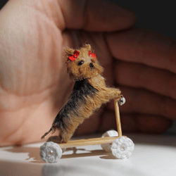 yorkie puppy on miniature scooter with a little collar so realistic and cutie