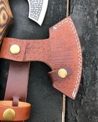 handcrafted engraved viking axe with ash wood handle - a symbol of power and tradition