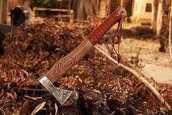 handcrafted engraved viking axe with ash wood handle - a symbol of power and tradition