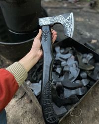 handcrafted engraved viking axe with ash wood handle - a symbol of power and tradition