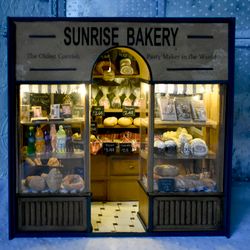 bakery miniature on the bookshelf with light