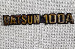 datsun 100a  emblem for the model of 1970