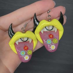 earrings. yellow lips with flowers.