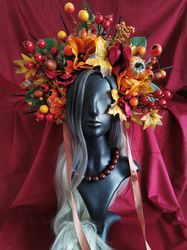 unleash your inner royalty with this stunning orange crown adorned with snakes and flowers – perfect for photo shoots an