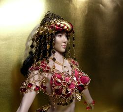 a phicen doll in a scheherazade costume from 1001 nights.