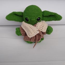 yoda crochet. the handmade toy is available and made to order.