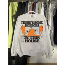 theres some horrors in this house sweatshirt, halloween party shirt, pumpkin halloween sweatshirt,
