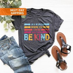 in a world where you can be anything be kind shirt, kids shi