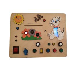 busy board dog with leds, volume controls, dog barking sounds, chirping sparrow, 12 english melodies, various buttons.