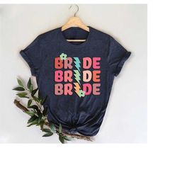 retro bride shirt,lightning bolt graphic bride t-shirt,vintage inspired bridal party shirts,bachelorette trip shirt,maid