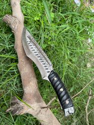 handmade damascus sanmai pattern knife with 8-inch blade and 5-inch handle with metal skull on the handle edge