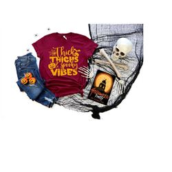 thick thighs and spooky vibes - halloween shirt, halloween shirts, halloween t-shirt, halloween tee, halloween tees, fun