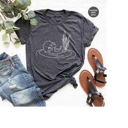 sea otter shirt, cute graphic tees, otter shirt, botanical t-shirt, otter gifts, plant shirt, cute otter vneck shirt, gi