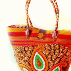 woven palm leaves straw bag with a blend of glass beads