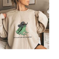 you just yee'd your last haw hooded sweatshirt. cowboy frog meme hooded sweatshirt gift idea. wild west hooded sweatshir