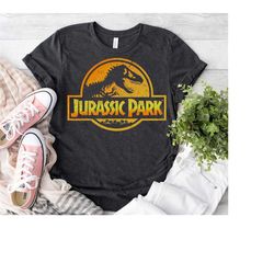 jurassic park orange & yellow gradient logo graphic t-shirt, jurassic world dinosaur t-rex shirt, disneyland trip family