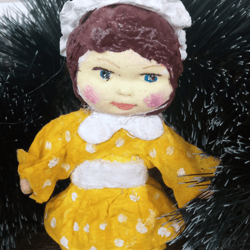 cute handmade cotton interior doll in yellow dress. christmas tree decoration