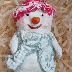 cute christmas/new year's toy snowman in a red hat handmade, paper mache snowman