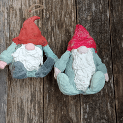 2 cute scandinavian gnomes handmade from paper mache in soothing colors