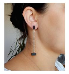 minimalist ebony earrings. stylish earrings on chains.