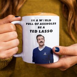 coach lasso mug, in a world full of assholes be kind mug, lasso believe cup