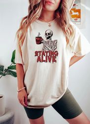 staying alive shirt png, trendy coffee shirt png, funny skeleton t-shirt png, coffee lovers gift, skull vintage t-shirt