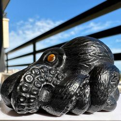 carved natural stone miniature octopus. handmade from obsidian.