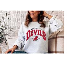 new jersey devils sweatshirt, nj hockey shirt, vintage ice hockey tee, jersey devils hoodie, 2022–23 new jersey devils,