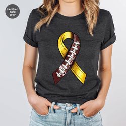 childhood cancer warrior t-shirt, cancer survivor kids clothing, gold cancer ribbon shirt, american football graphic tee