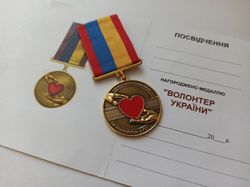 ukrainian medal "volunteer of ukraine " with doc.  glory to ukraine