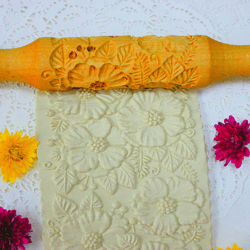 rolling pins with flowers,  stamp cookie cutter ,a rolling pin, cookie cutter