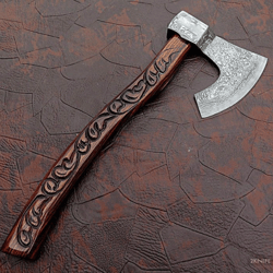 a very beautiful handmade damascus steel axe