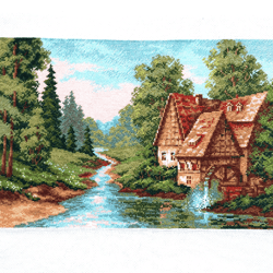 completed cross stitch: old stone mill landscape with churning water and english cottage