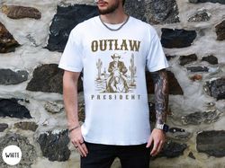 outlaw president trump t-shirt, western donald trump cowboy shirt, trump convicted booking not-guilty, funny tump shirt