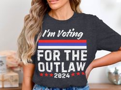 im voting for the outlaw 2024 t-shirt, funny political shirt, election shirt, patriotic graphic t-shirt