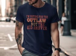 im voting for the outlaw not the kid sniffer funny political t-shirt, trendy patriotic graphic shirt, unique gift