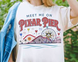 retro disney meet me at pixar pier shirt | disneyland resort pixar fest 2024 t-shirt | pixar pals playtime party tee | w