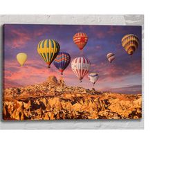 balloons flying in the sky in cappadocia wall